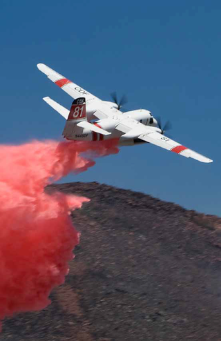 Illustration for article titled Why Airplanes Dump Red 'Water' On Fires